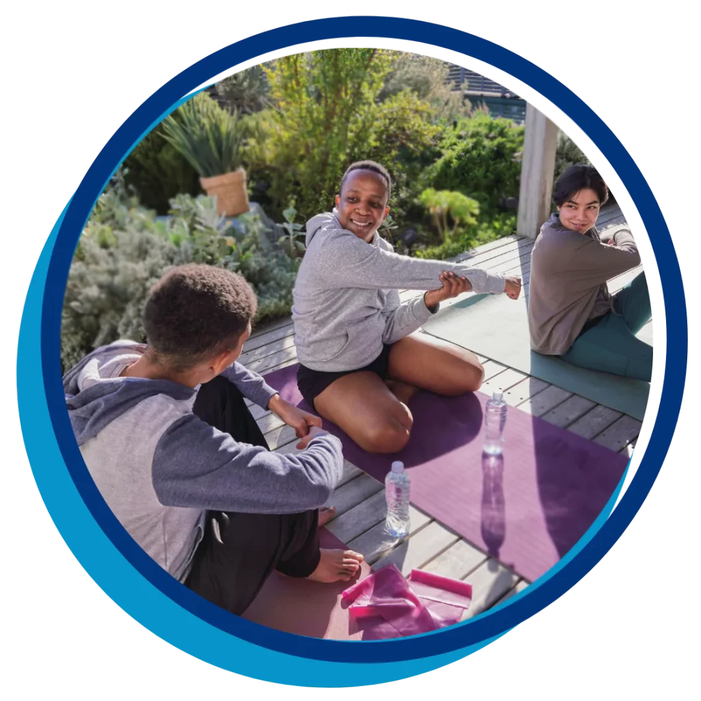 A group of disabled friends are enjoying a yoga class together while outdoors